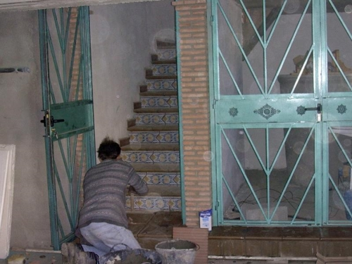 The tiles on the stairs are being installed (April 17, 2005)